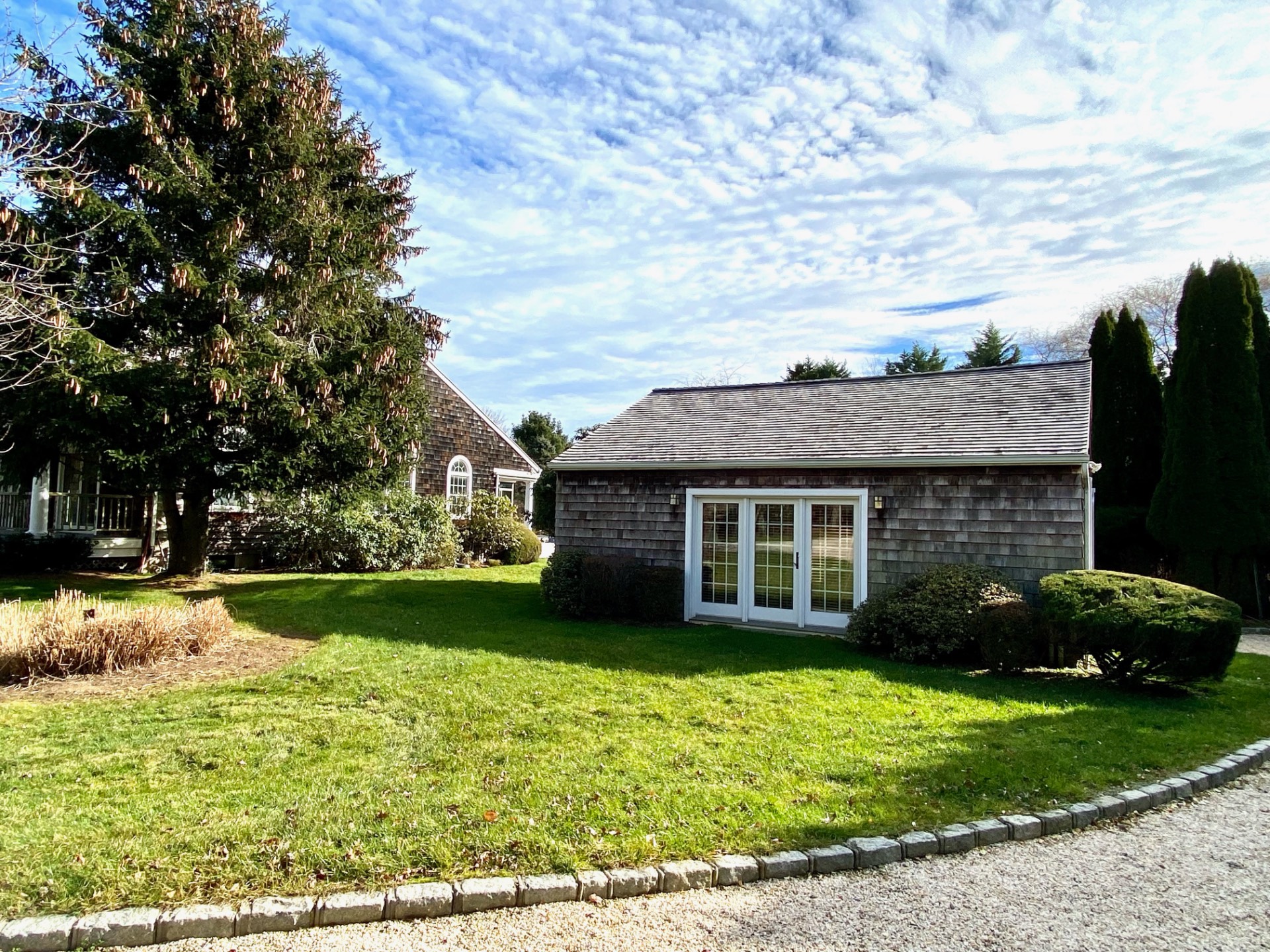 491 Butter Lane Bridgehampton, NY 11932 - Photo 2 of 39 front view of a house with a yard