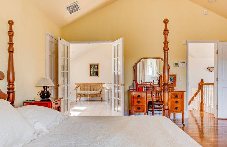 491 Butter Lane Bridgehampton, NY 11932 - Photo 23 of 39 a view of living room filled with furniture and large windows