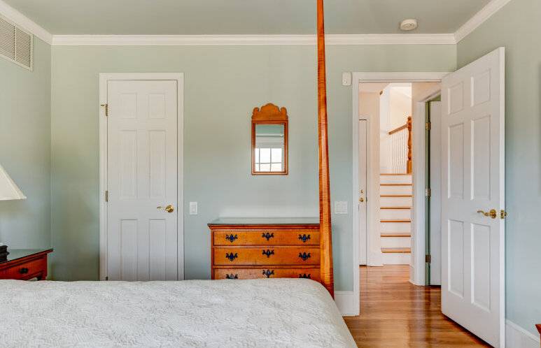 491 Butter Lane Bridgehampton, NY 11932 - Photo 26 of 39 a bedroom with a bed and wooden floor