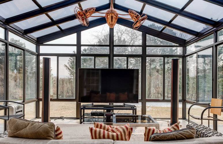 491 Butter Lane Bridgehampton, NY 11932 - Photo 28 of 39 a living room with furniture and a flat screen tv