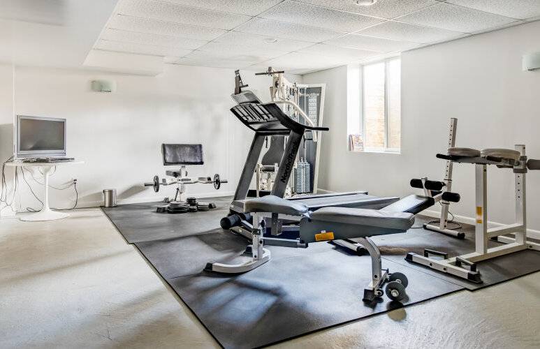 491 Butter Lane Bridgehampton, NY 11932 - Photo 29 of 39 a view of a room with gym equipment
