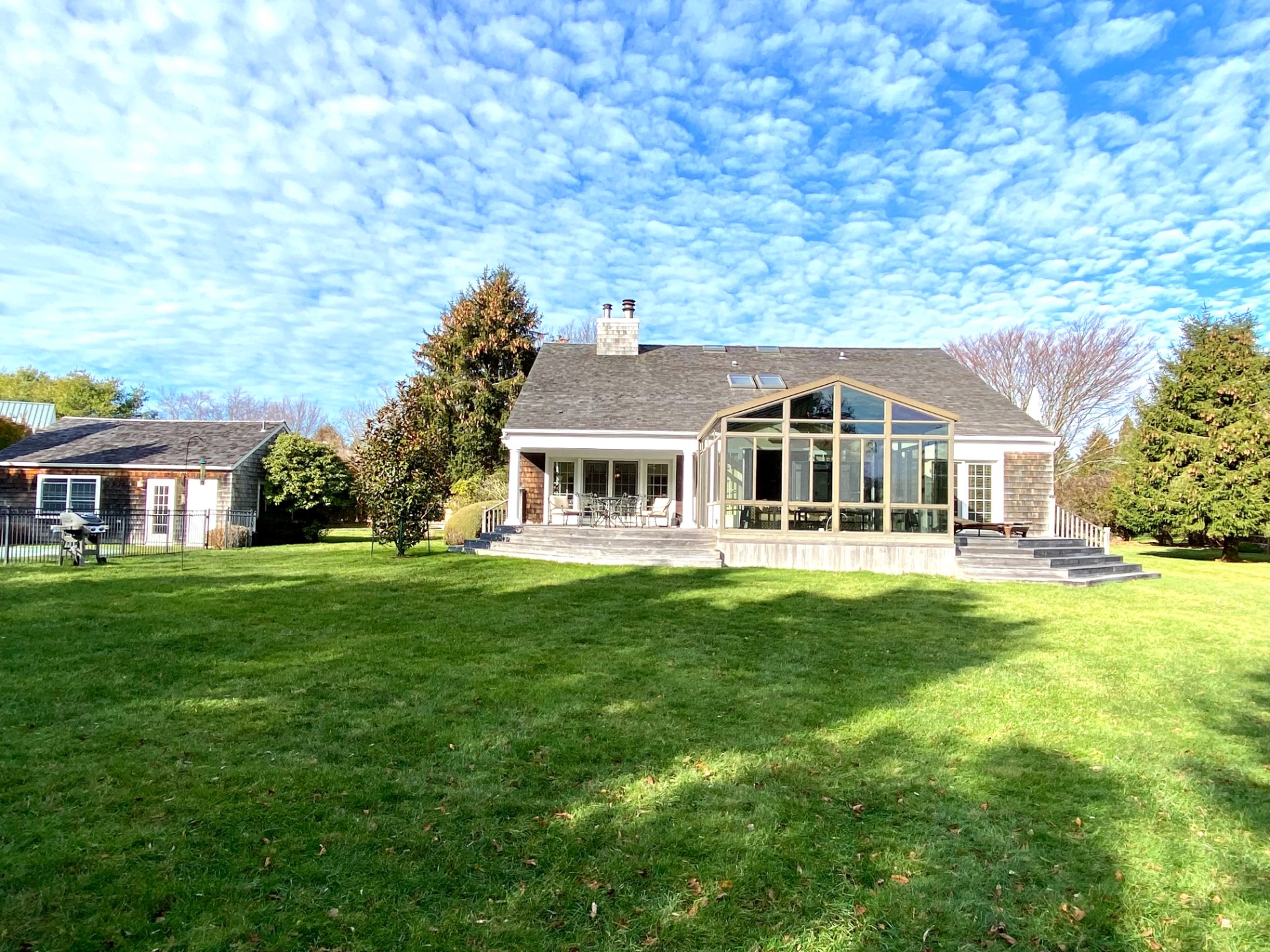 491 Butter Lane Bridgehampton, NY 11932 - Photo 3 of 39 a front view of a house with a garden