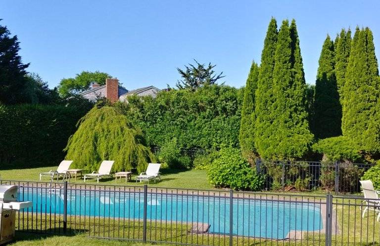 491 Butter Lane Bridgehampton, NY 11932 - Photo 31 of 39 a view of a balcony with a garden