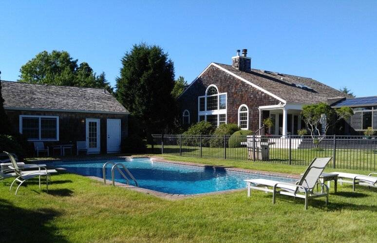 491 Butter Lane Bridgehampton, NY 11932 - Photo 32 of 39 a view of house with swimming pool yard and outdoor seating