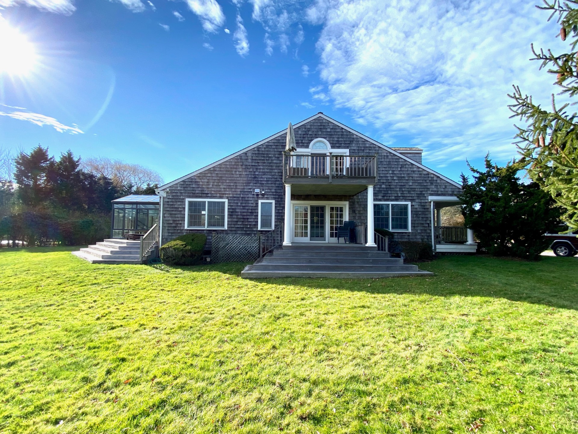 491 Butter Lane Bridgehampton, NY 11932 - Photo 38 of 39 a front view of a house with a yard