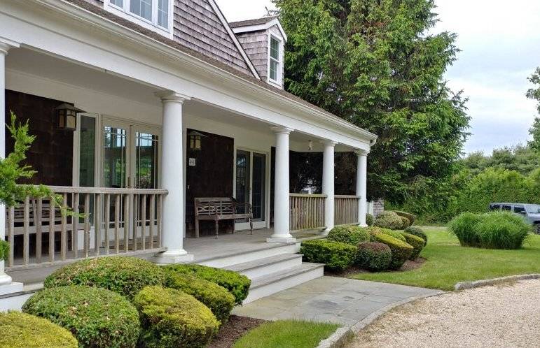 491 Butter Lane Bridgehampton, NY 11932 - Photo 5 of 39 a view of a house with a small yard plants and large tree