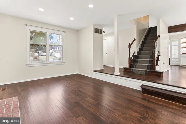a bathroom with a sink mirror vanity and toilet