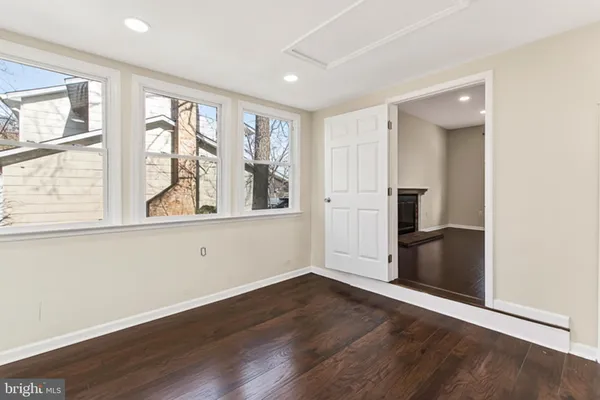 a bed room with a bed window and a chandelier