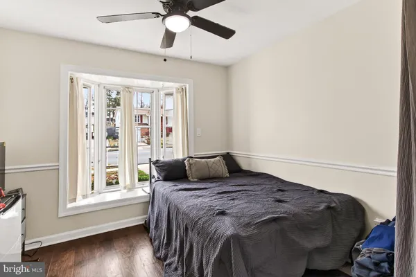 a bedroom with furniture and a window
