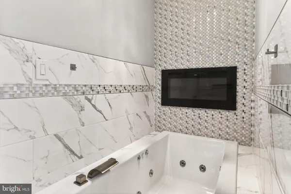 a bathroom with a sink and vanity