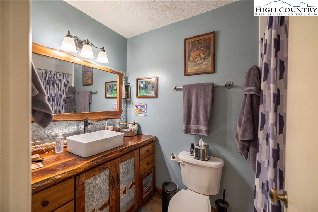 150 Timberlake Sparta, NC 28675 - Photo 26 of 36 a bathroom with a sink mirror vanity and toilet