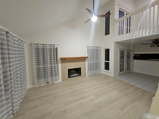 a view of an empty room with glass door