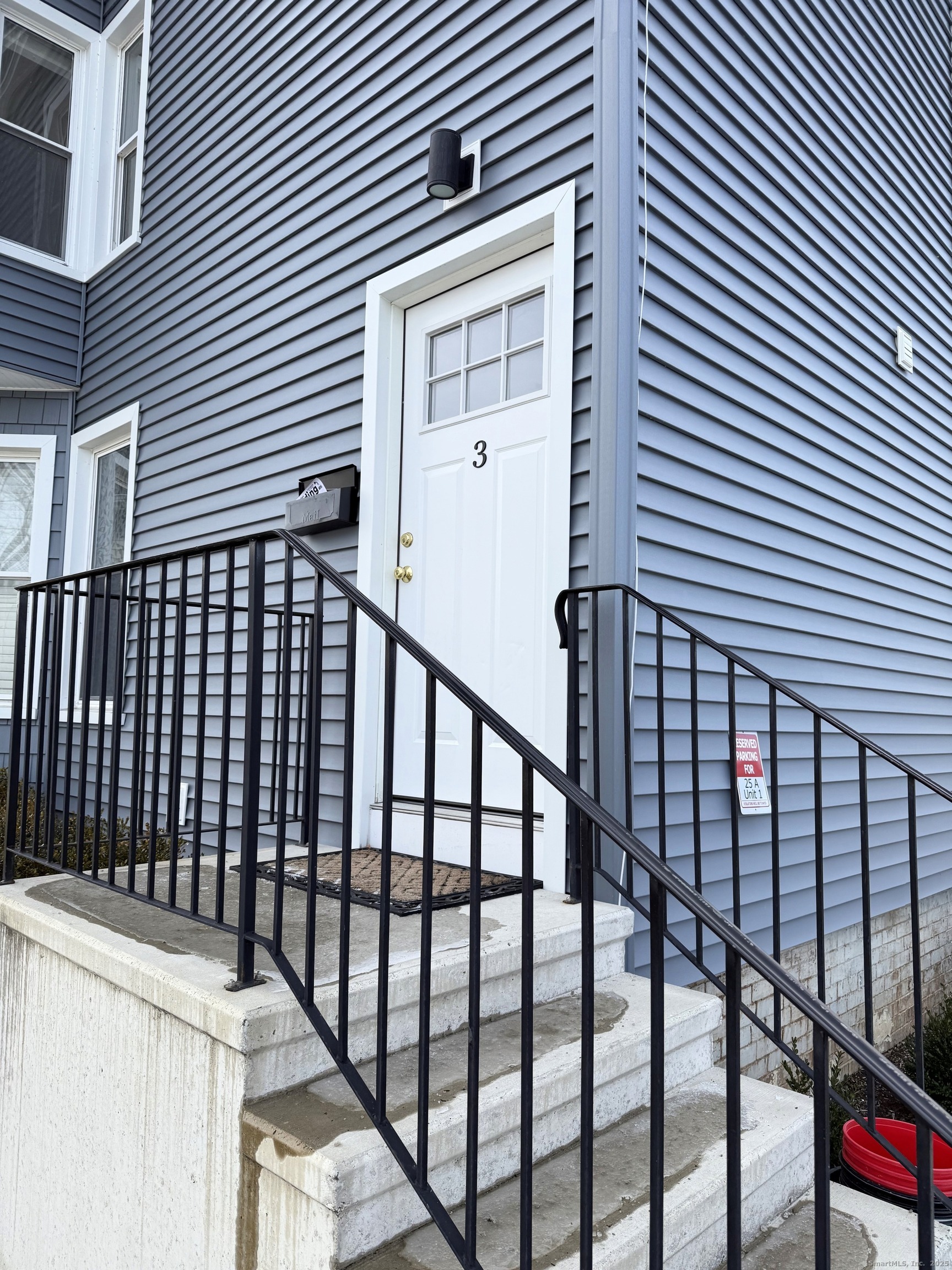 25 A Bridge Street, Unit 3 New Milford, CT 06776 - Photo 1 of 15 a view of a balcony with a white door