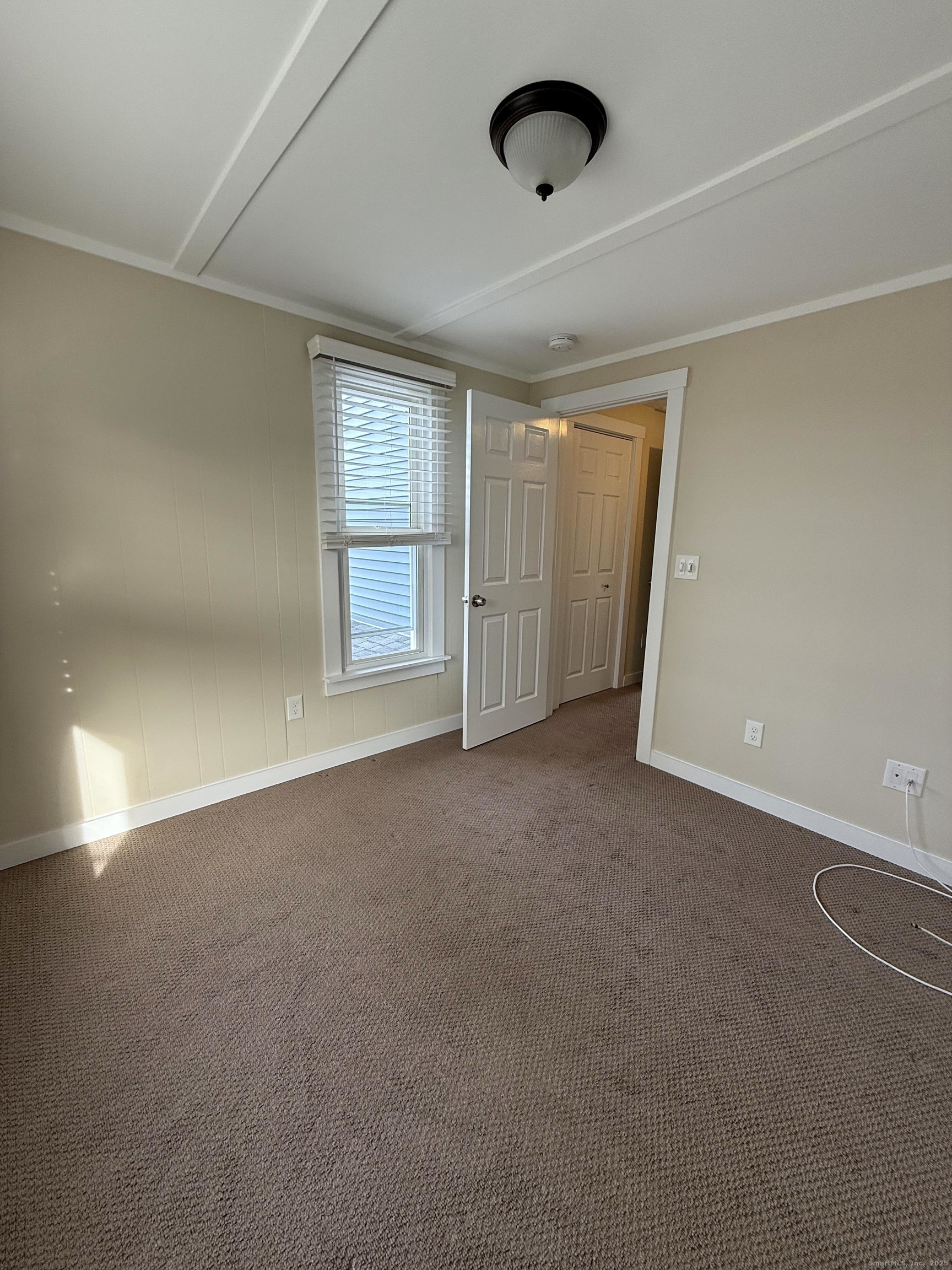 25 A Bridge Street, Unit 3 New Milford, CT 06776 - Photo 12 of 15 an empty room with a empty space and windows