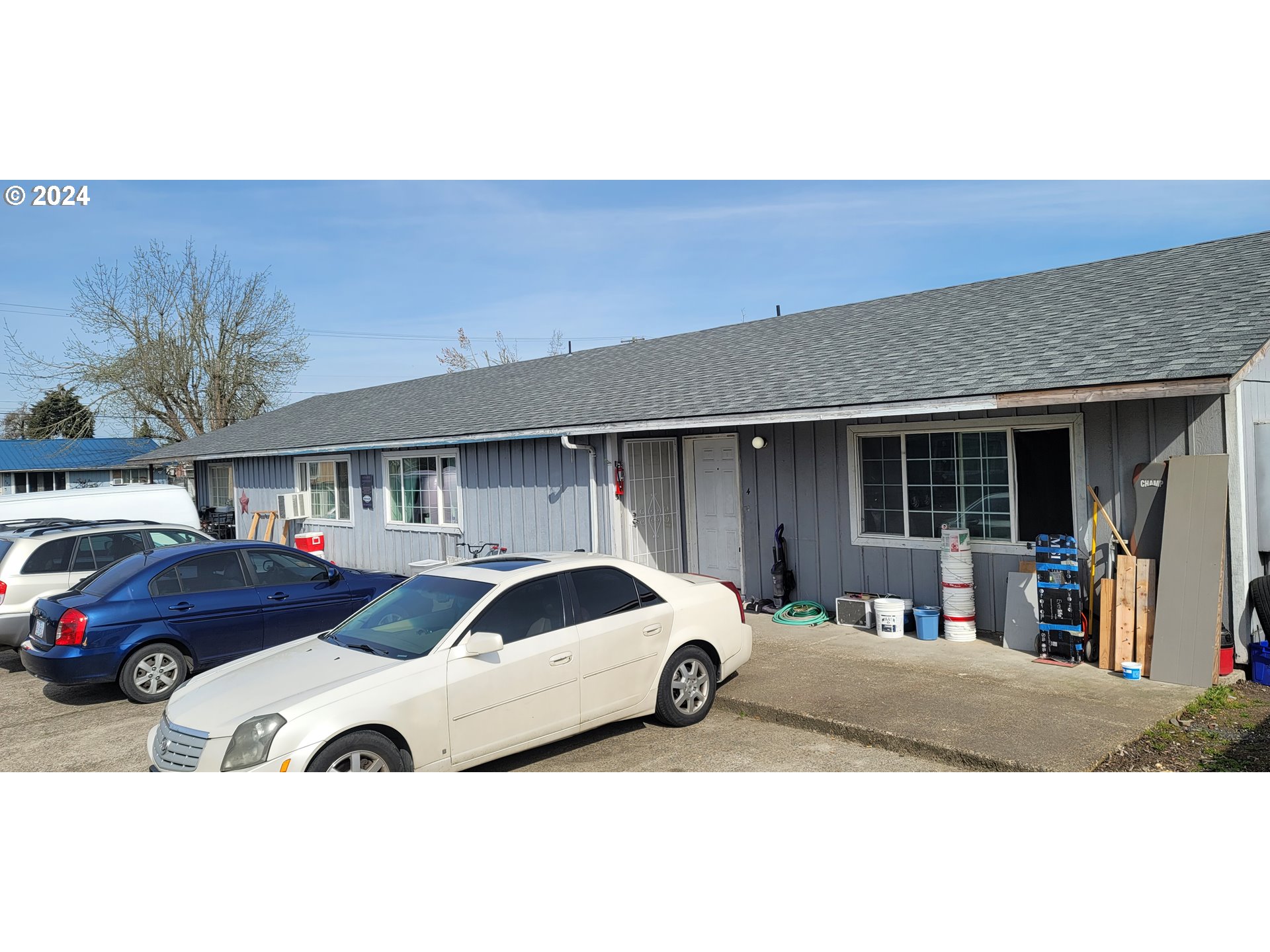 a front view of a house with parking space