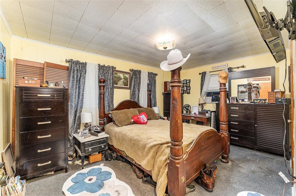 910 Bumby Lane Wauchula, FL 33873 - Photo 16 of 37 a bedroom with furniture and a large window