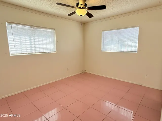 a view of an entryway with a chandelier fan