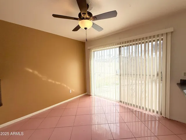 a view of a kitchen with a sink and microwave