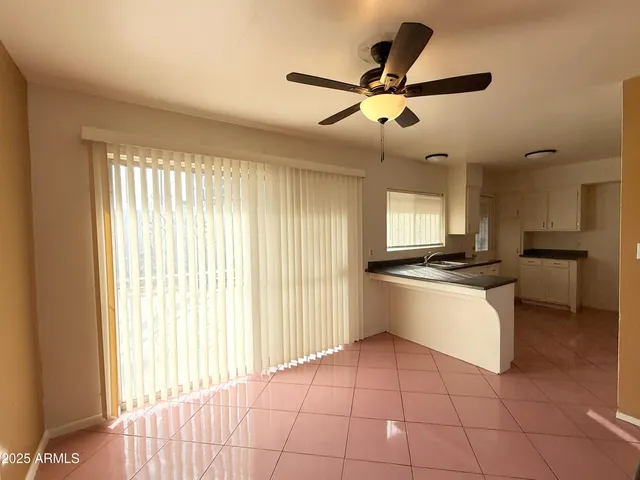 a kitchen that has a sink and a stove