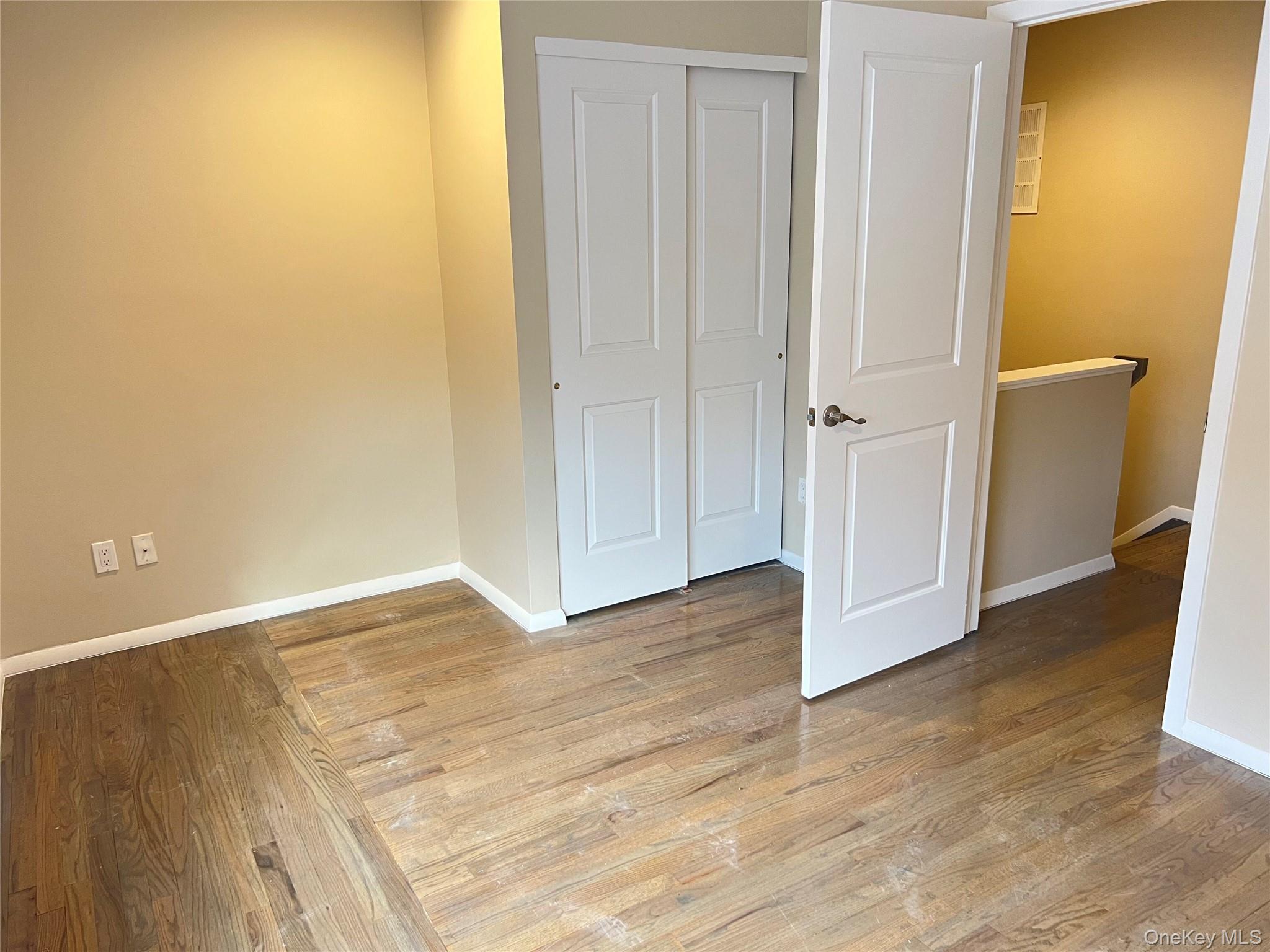 60 Marwood Road North, Unit B / RIGHT Port Washington, NY 11050 - Photo 10 of 19 a view of an empty room with wooden floor and closet