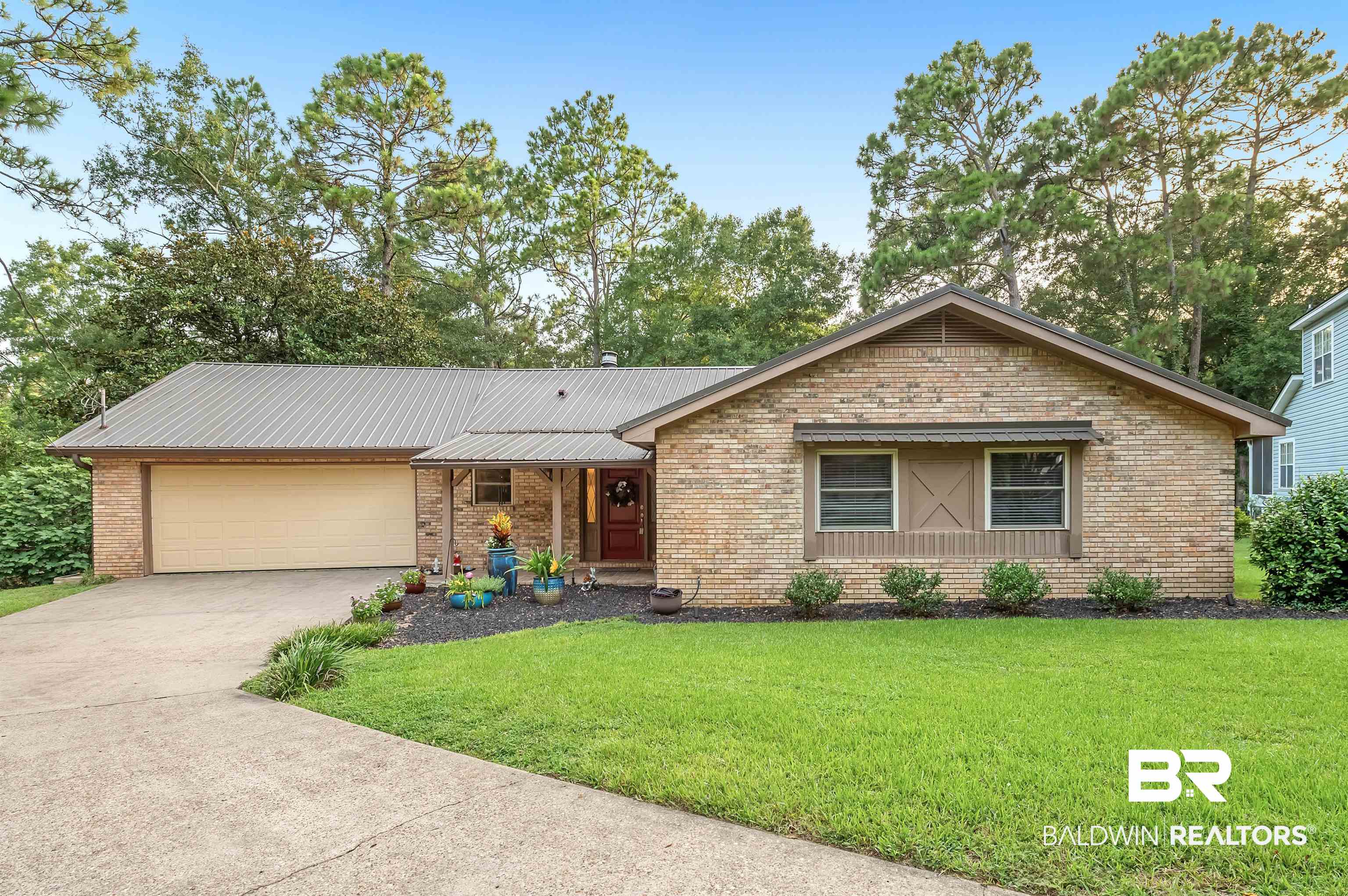 104 James Circle Daphne, AL 36526 - Photo 3 of 62 Ranch-style house featuring a garage and a front yard