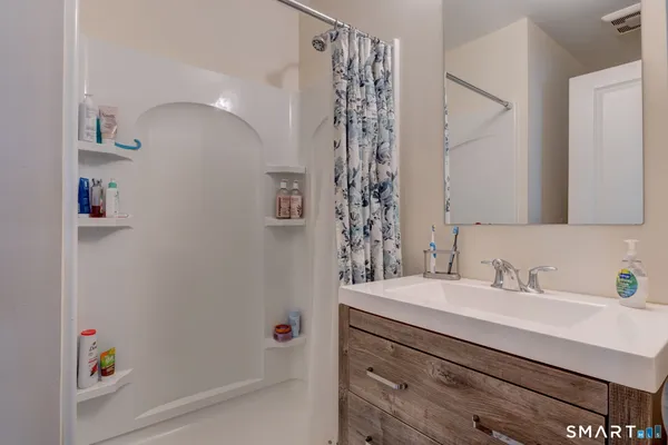 a bathroom with a sink and a mirror