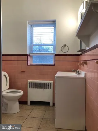 a bathroom with a glass door shower