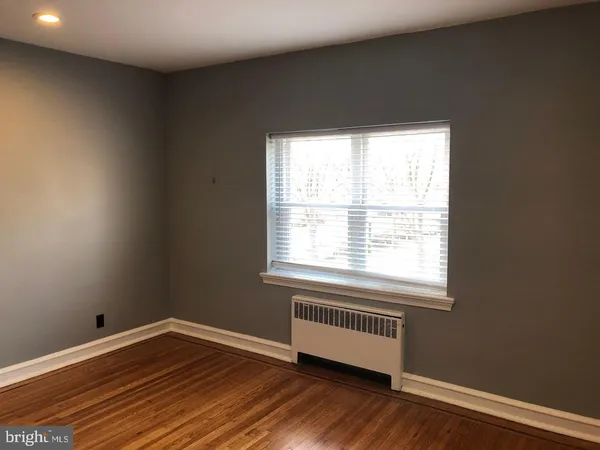 a view of room with wooden floor