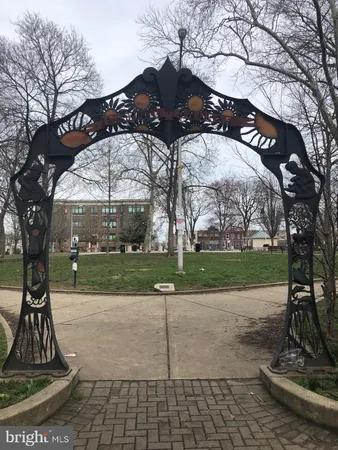 a park bench sitting in the middle of a park