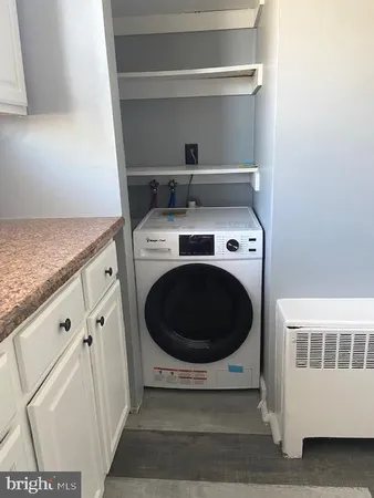 a kitchen with a washer and dryer