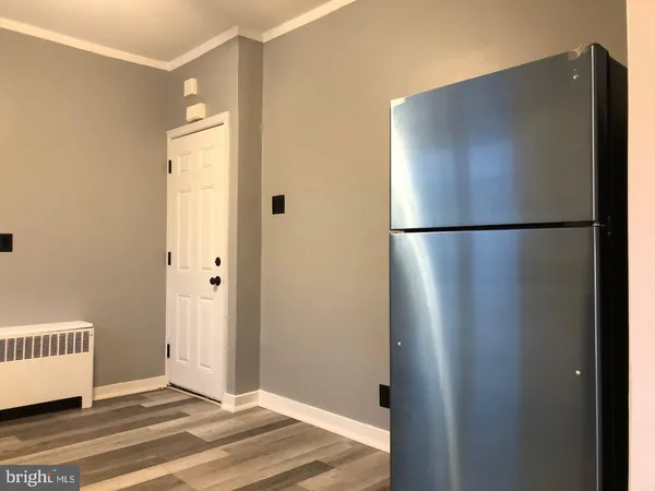 a stove top oven sitting inside of a kitchen