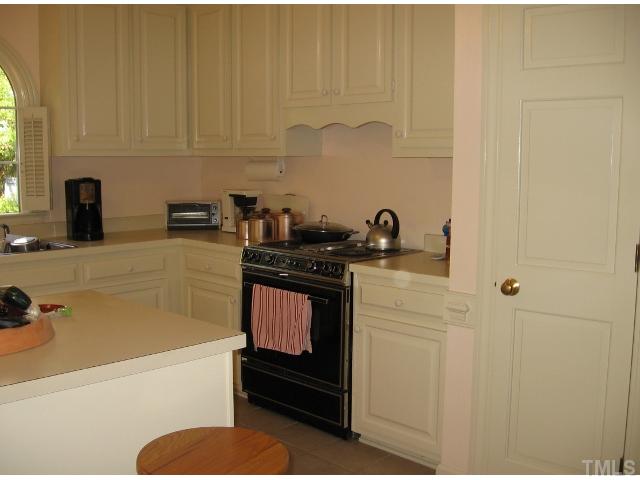 210 Winterberry Ridge Drive Durham, NC 27713 - Photo 9 of 24 Lots of workspace and the door leads to a good sized pantry. Jenn-Aire range