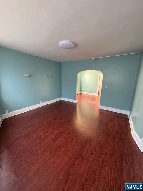 295 Midland Avenue, Unit 1 Garfield, NJ 07026 - Photo 2 of 8 a view of an empty room with wooden floor