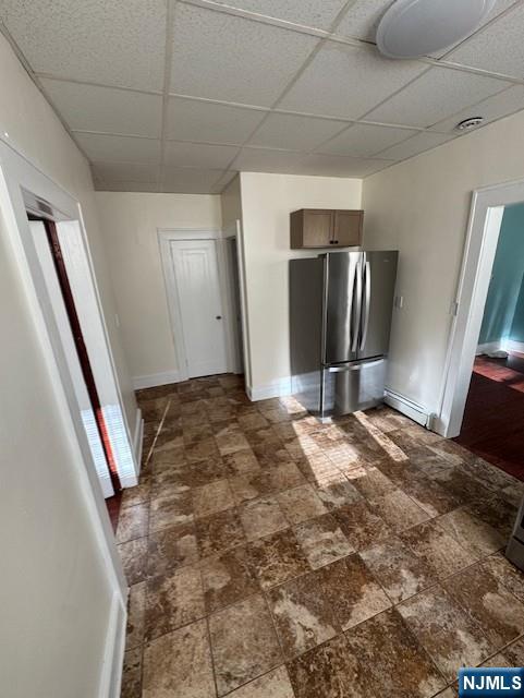 295 Midland Avenue, Unit 1 Garfield, NJ 07026 - Photo 4 of 8 a view of a refrigerator in kitchen and a window