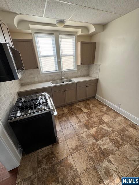 295 Midland Avenue, Unit 1 Garfield, NJ 07026 - Photo 5 of 8 a kitchen with a stove and a refrigerator
