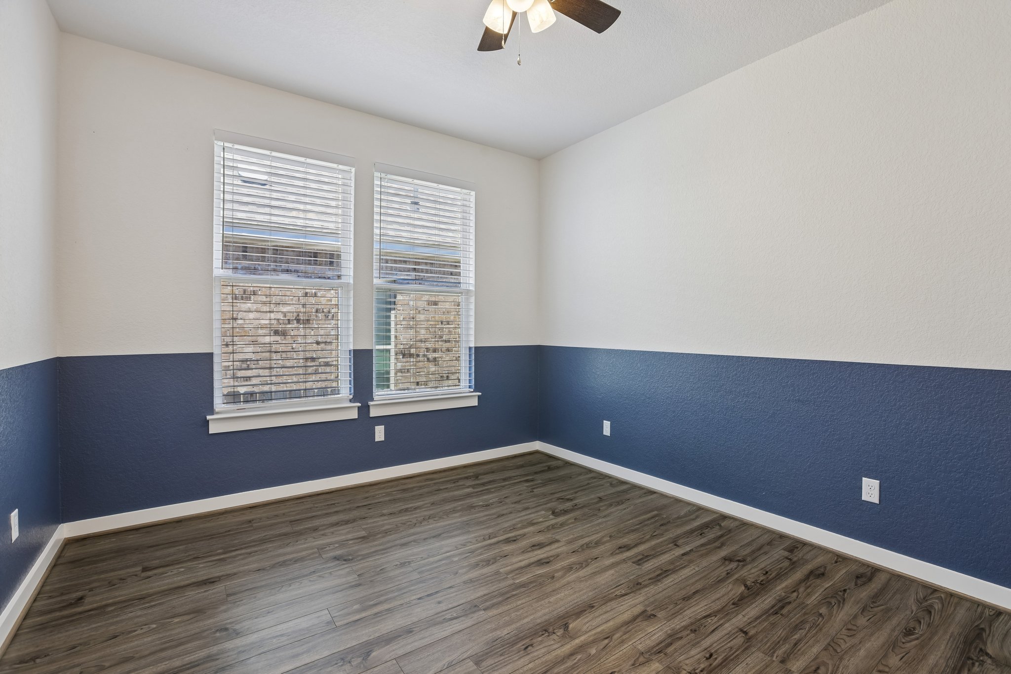 317 Independence Drive Kyle, TX 78640 - Photo 25 of 40 wooden floor and window in an empty room