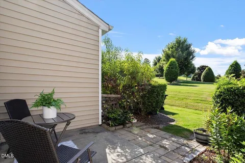 a view of backyard with seating space