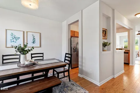 a view of a dining room with furniture and wooden floor