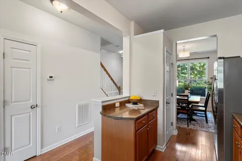 a view of kitchen island with furniture and wooden floor