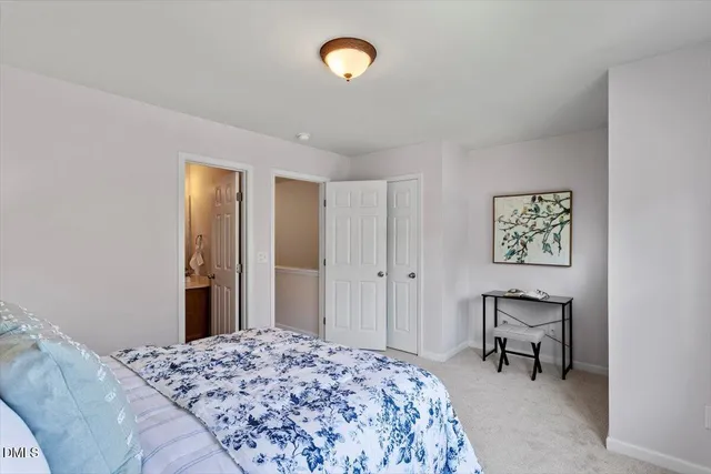 a bedroom with a bed and furniture