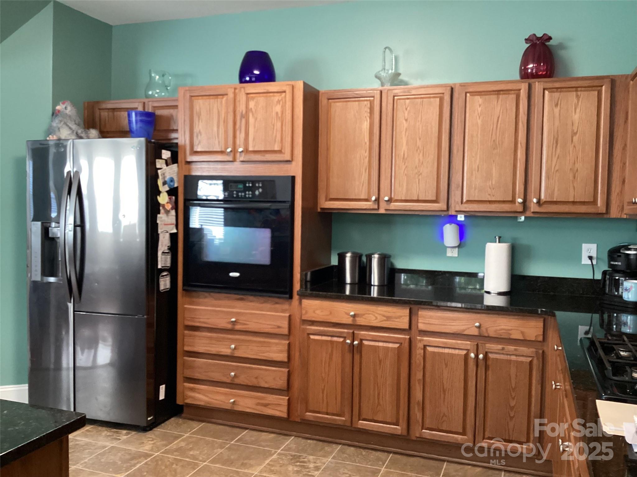 408 Indigo Ridge Drive Columbia, SC 29229 - Photo 5 of 17 a kitchen with stainless steel appliances granite countertop a refrigerator and a stove