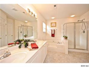 118 Hollyhurst Lane Fort Mill, SC 29708 - Photo 11 of 16 a bathroom with a tub sink mirror and shower