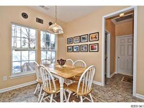 118 Hollyhurst Lane Fort Mill, SC 29708 - Photo 8 of 16 a view of a dining room with furniture and chandelier