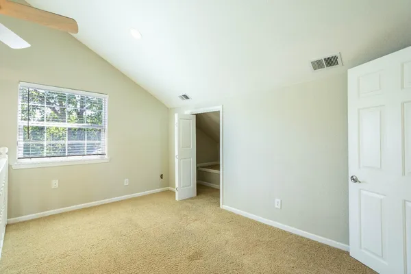 a view of a big room with windows and cabinet