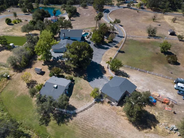 an aerial view of residential house with outdoor space