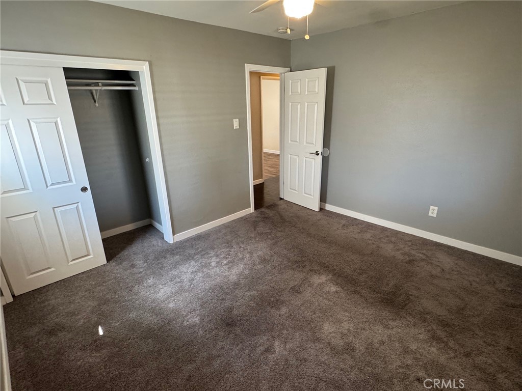 926 Griffith Way Hemet, CA 92543 - Photo 13 of 30 an empty room with windows and closet