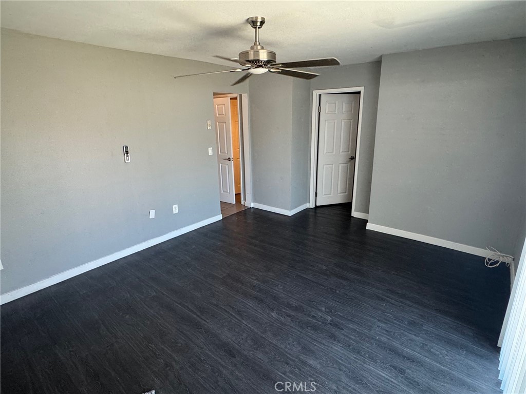 926 Griffith Way Hemet, CA 92543 - Photo 17 of 30 a view of an empty room with wooden floor