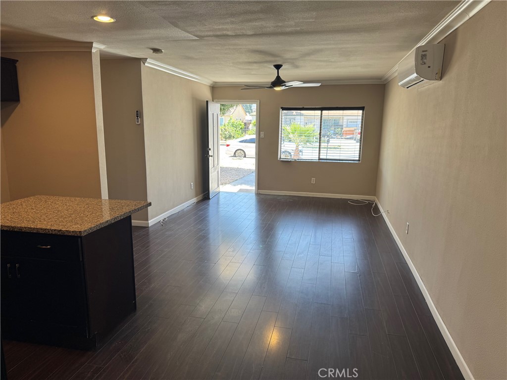 926 Griffith Way Hemet, CA 92543 - Photo 27 of 30 a view of an empty room with a window and wooden floor