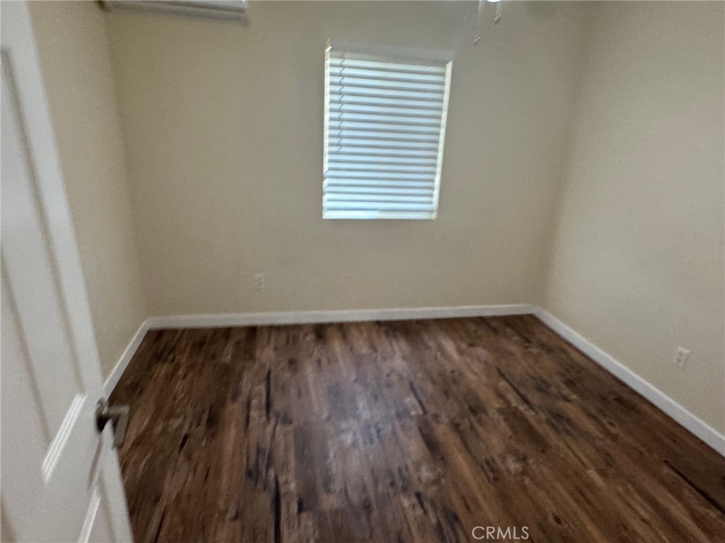 926 Griffith Way Hemet, CA 92543 - Photo 8 of 30 a view of a room with wooden floor and window