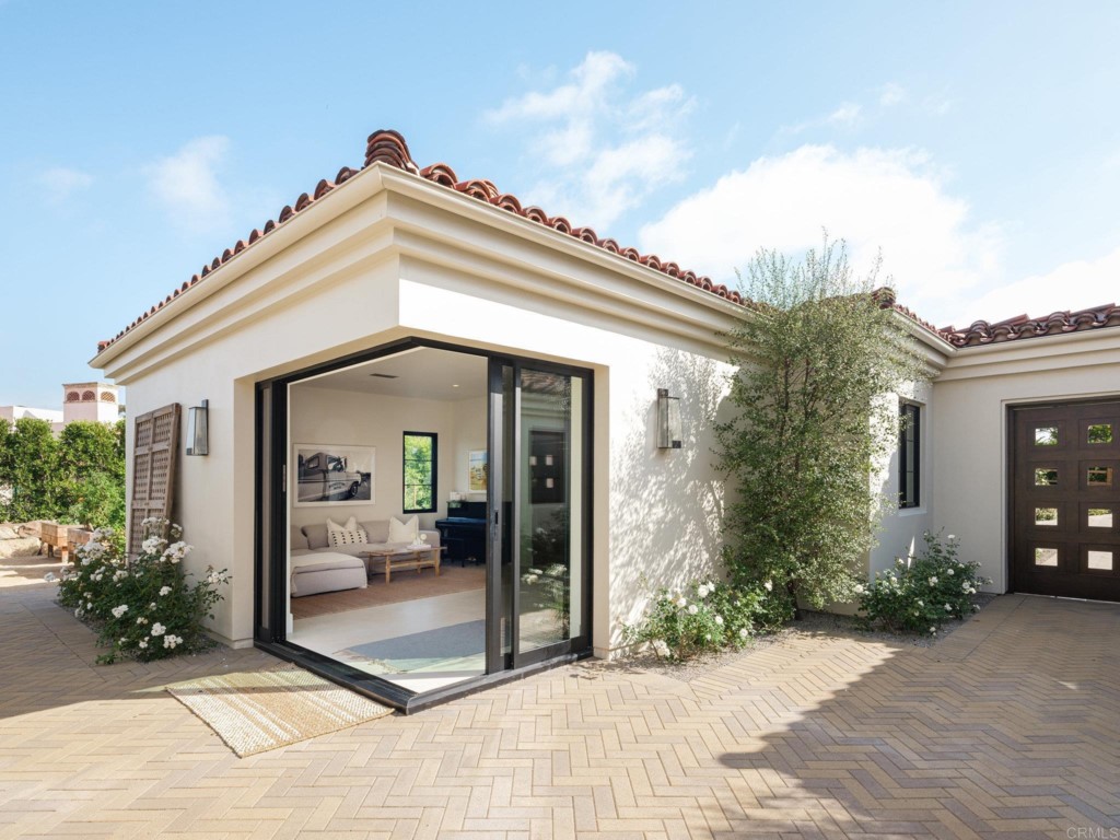5516 La Crescenta Road Rancho Santa Fe, CA 92067 - Photo 13 of 68 a view of a house with potted plants